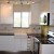 Condo Kitchen with IKEA Cabinets and Uba Tuba Granite