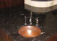 Antique Brown Counter with Copper Sink and Undulating Edge