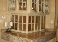 Typhoon Bordeaux Granite Ledge on a Crystal Cabinet