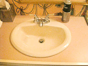 drop-in sink in an old laminated countertop