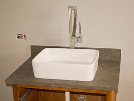 Kraus Vessel Sink on Limestone Counters with a Flat-Polish Edge